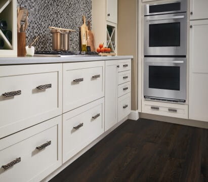 Spotted cabinet hardware shown in a kitchen