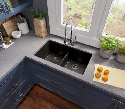 Dark sink shown in a kitchen