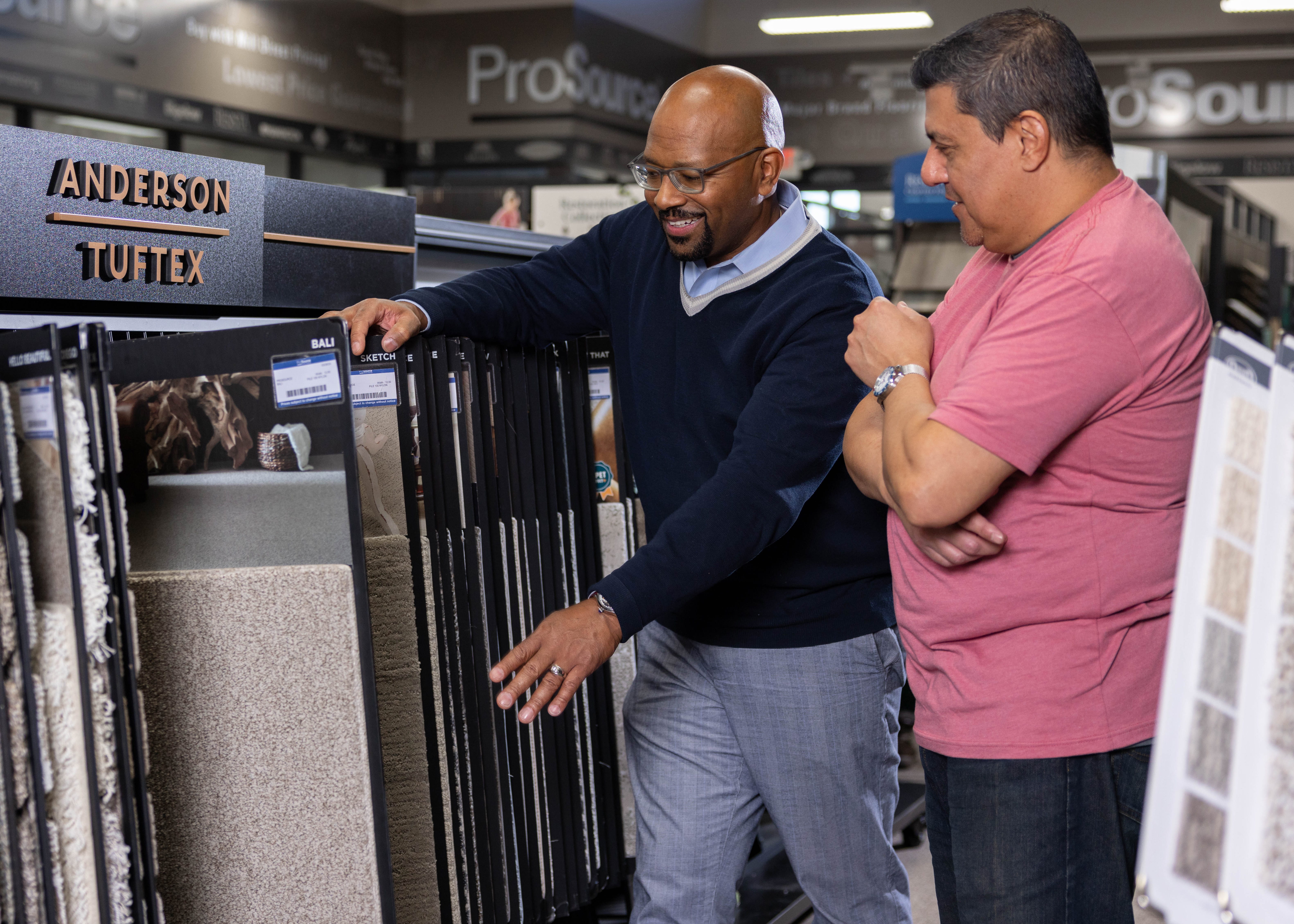 ProSource Account Manager showing some materials to a Trade Pro member. 