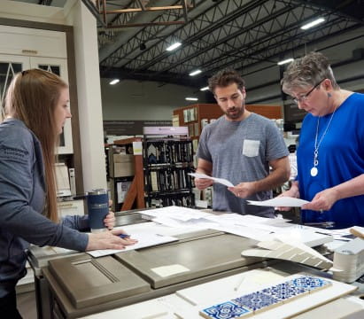 Homeowners and their account manager meeting over products