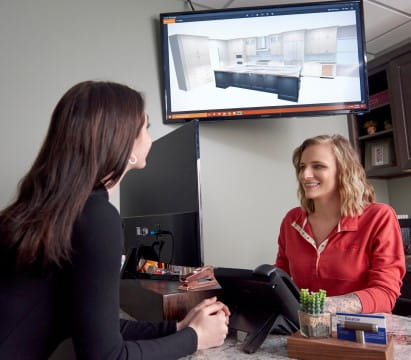 Kitchen and bath designer meeting with a client