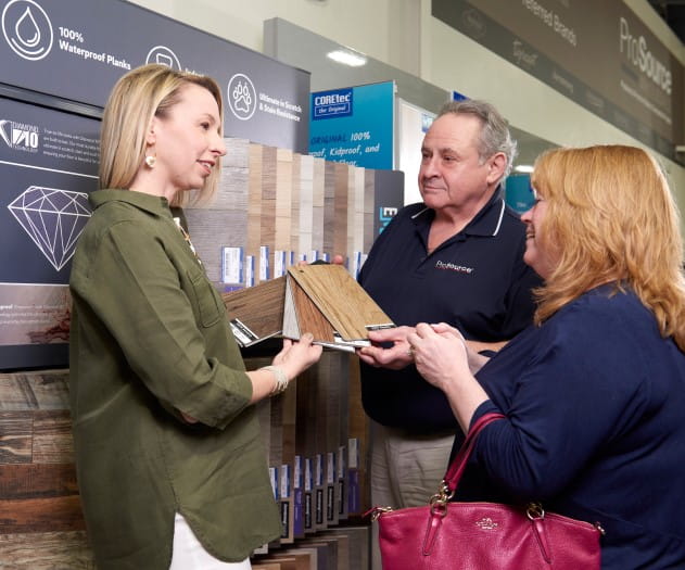Homeowner meeting with an account manager and trade professional in a ProSource showroom
